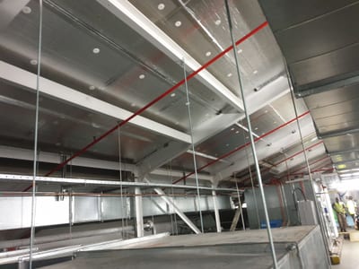 Rigid insulation boards fixed to the underside of a concrete soffit slab